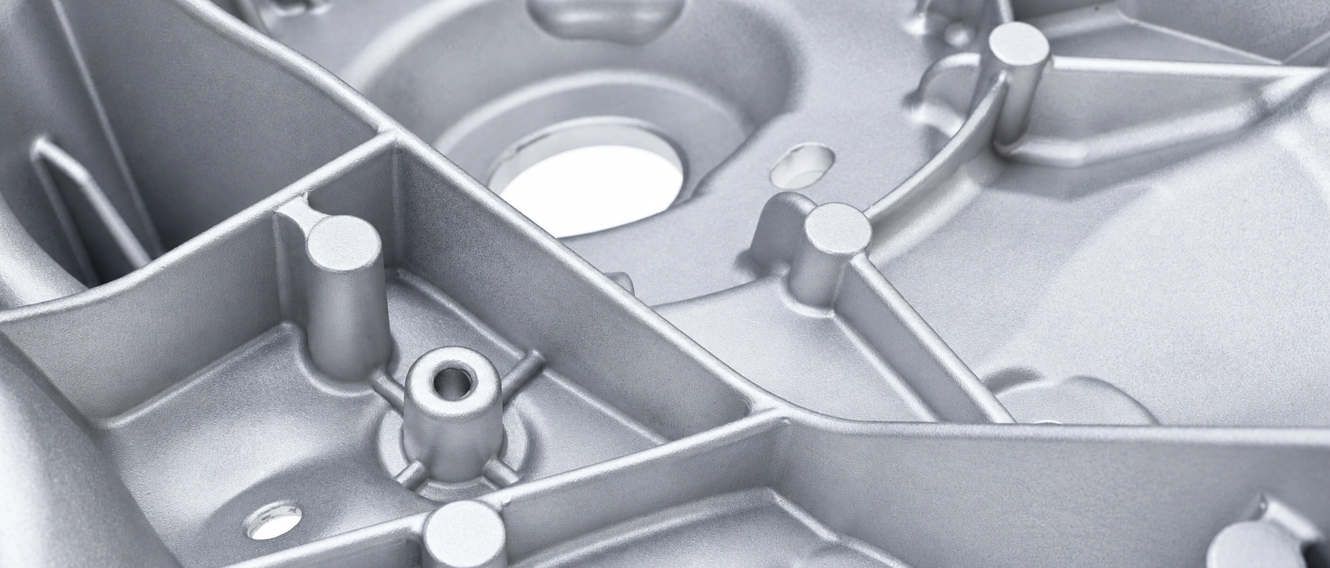 Close-up of aluminum casting ribs, bosses and openings.
