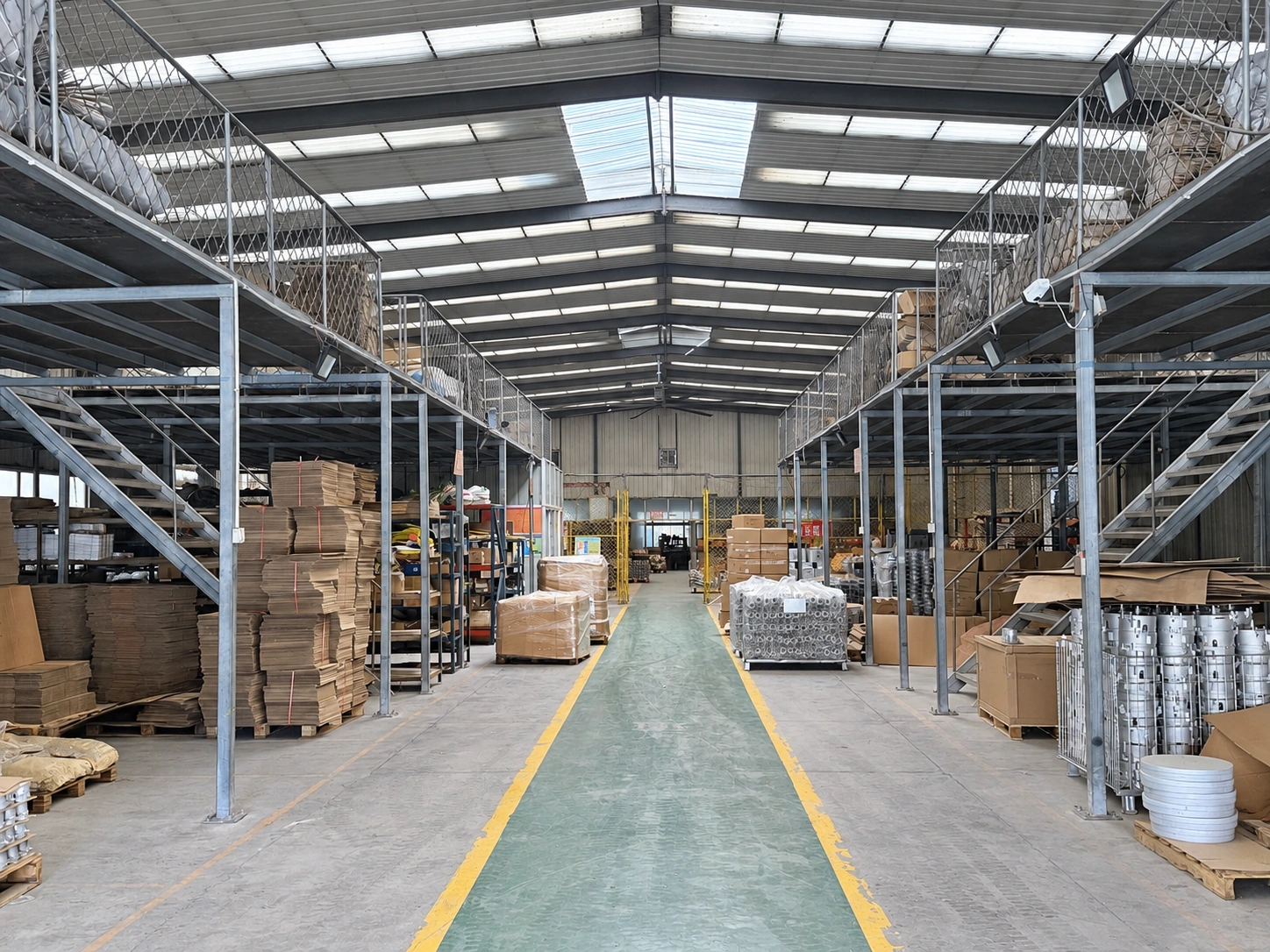 Workshop storage aisle with racks, packed parts and yellow walkway markings.